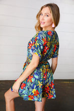 Load image into Gallery viewer, Navy Tropical Floral Surplice Romper