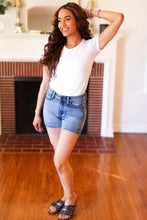 Load image into Gallery viewer, Judy Blue Medium Blue Mid-Rise Button Flap Back Pocket Denim Shorts
