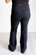 Load image into Gallery viewer, Building Habits Twill Flared Crossover Waist Pant in Black
