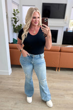 Load image into Gallery viewer, Caroline Mid Rise Control Top Distressed Flare Jeans
